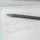 The A5 stylus resting on the InkNote Color's screen.